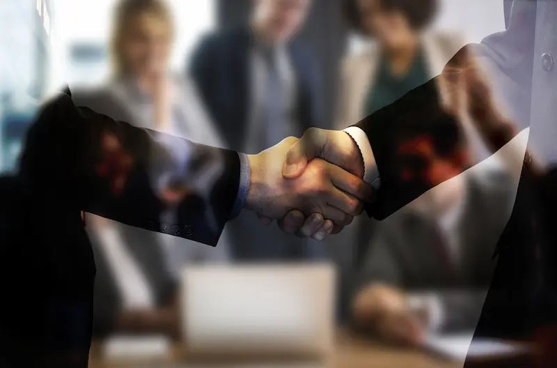 Family Business partners shaking hands